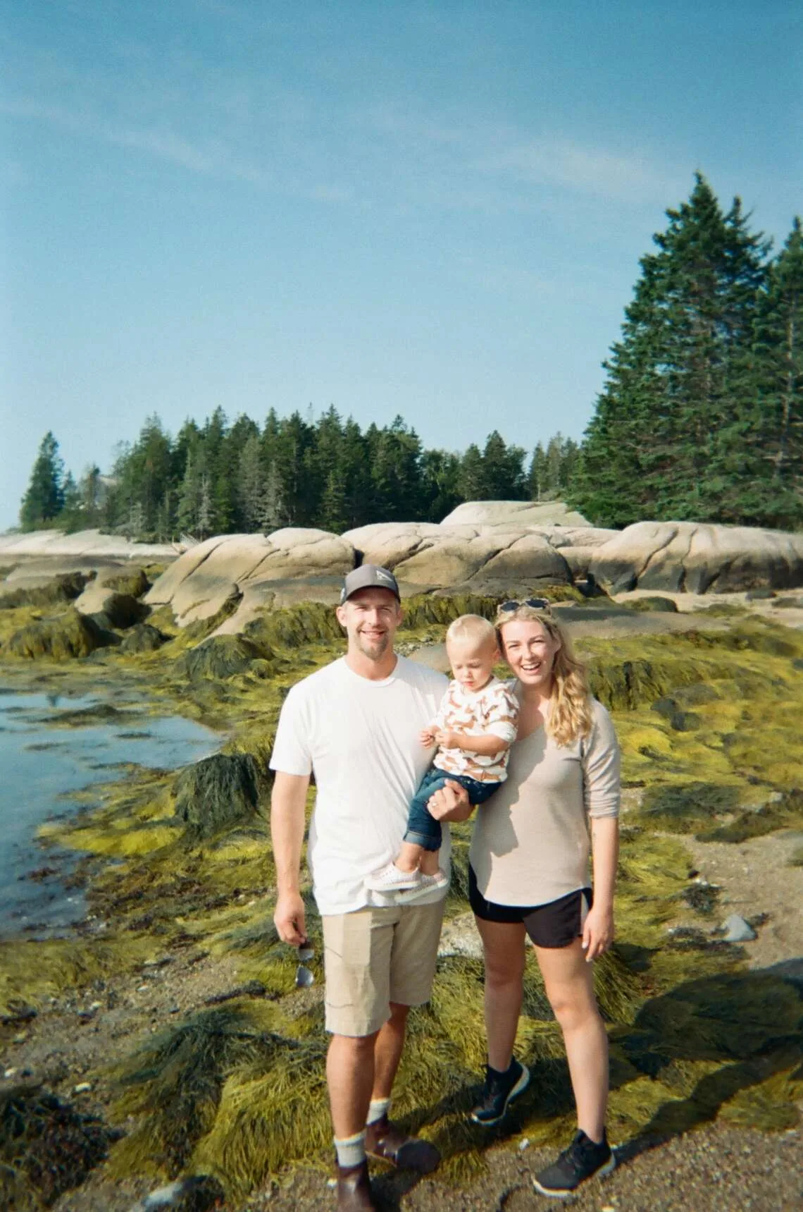 David, Laura, and family on the rocky shore of North Haven